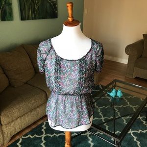 Sheer black top with purple pink floral print